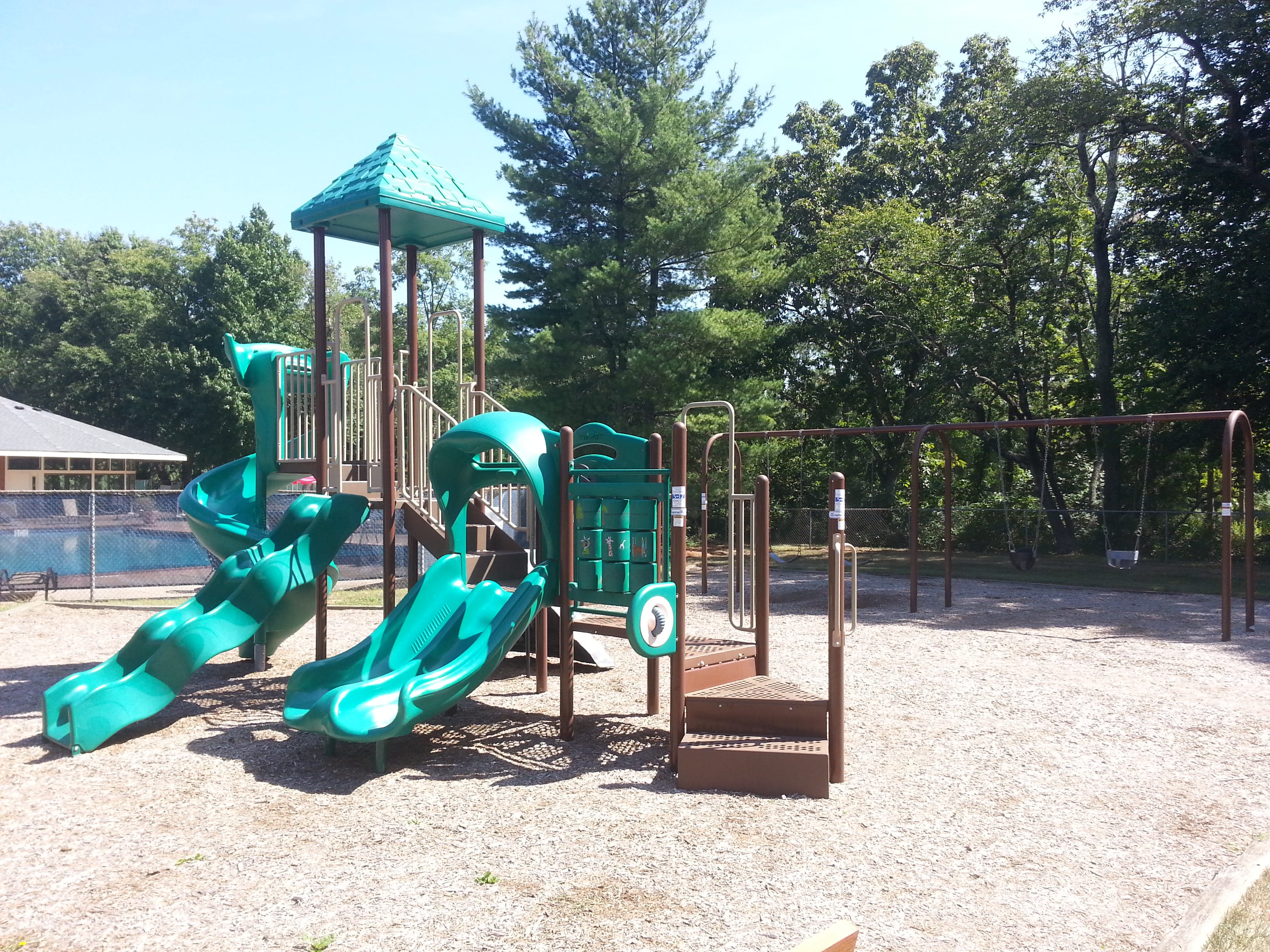 Located next to the Winding Brook pool is this tot lot for children.